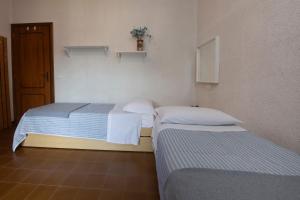 Ένα ή περισσότερα κρεβάτια σε δωμάτιο στο 229 - Casa di Magda - Moneglia, 5minuti a piedi dal mare e spiaggia - PARCHEGGIO PRIVATO INCLUSO