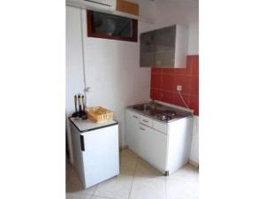Kuchyňa alebo kuchynka v ubytovaní Apartments Tina