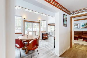 a dining room and living room with a table and chairs at Blue Skies & Bay Bliss in Carnelian Bay