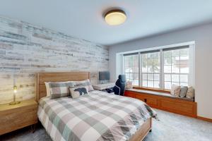 a bedroom with a bed and a window at Blue Skies & Bay Bliss in Carnelian Bay