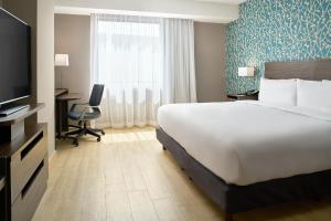 Giường trong phòng chung tại Fairfield Inn & Suites by Marriott Aguascalientes