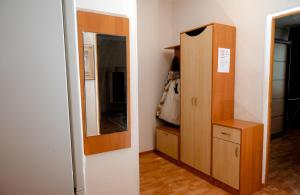 a room with a mirror and a dresser and a cabinet at 2 комнатная квартира, по суточно, напротив ТД Сырымбет in Kokshetau