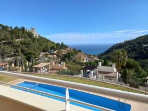 a view of the ocean from the balcony of a house at Balcon de Altea hills in Altea