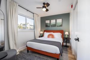 a bedroom with a bed and a window at Stylish Condo in Hillsboro Village 3 Beds and Parking in Nashville