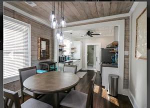 a kitchen and dining room with a table and chairs at Cozy Crab Pad in Galveston