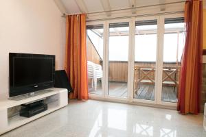 Televisyen dan/atau pusat hiburan di Apartment Hinterberg
