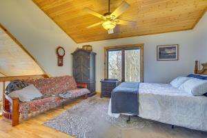 a bedroom with a bed and a ceiling fan at Spacious Stoddard Retreat on Mississippi River! 