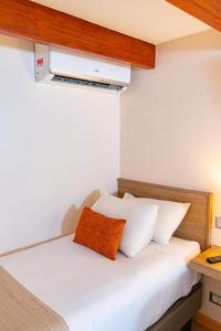 Postel nebo postele na pokoji v ubytování Tagle Hotel Boutique