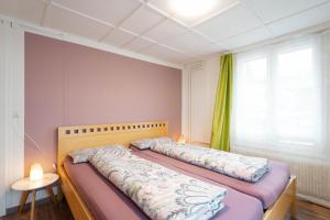 Rúm í herbergi á Apartment Heimathus