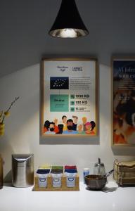 a kitchen counter with four bowls and a picture on the wall at Frederiksdal Sinatur Hotel & Konference in Kongens Lyngby +37 photos