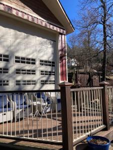 a screened in porch with a building in the background at All Seasons Treehouse Village in Eureka Springs