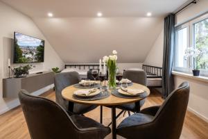 a dining room with a table and chairs at Apartment Milse - Modern. Stylisch in Bielefeld