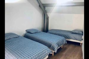 Katil atau katil-katil dalam bilik di Duplex 8 lits proche forêt Fontainebleau