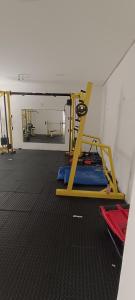 a room with a gym with a bed in it at Beira-Mar flat 310 Ponta Negra Beach in Natal