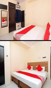 a bedroom with two beds with red pillows at Hotel moon place in Lucknow