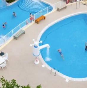 an overhead view of a swimming pool on a cruise ship at Beautiful sea view 3 bedroomed Holiday Home Caravan in Exmouth