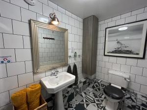 a bathroom with a sink and a toilet at Worth House in Cambridge
