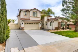 a driveway in front of a house at Spacious Clovis Vacation Rental with Outdoor Oasis! in Clovis