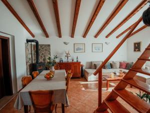 a living room with a table and a couch at Holiday home Jukan in Vrulje