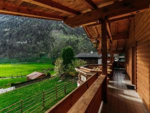 a balcony of a house with a view of the mountains at Barney L in Rauris