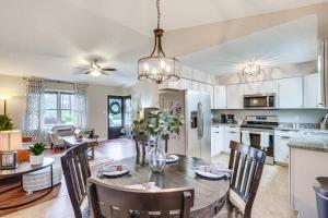 a kitchen and dining room with a table and chairs at Mebane Home with Private Yard Steps to Downtown! in Mebane