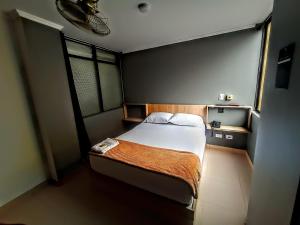 Voodi või voodid majutusasutuse Hotel Ruiseñor Itagui toas