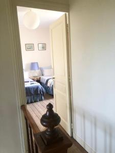 Postel nebo postele na pokoji v ubytování Le Vieux Manoir