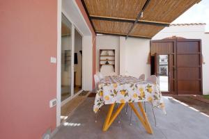 a dining room with a table and chairs at Newly built Holiday House in Teulada in Teulada