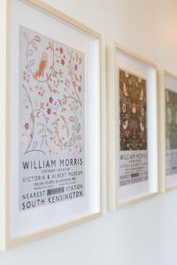 three framed prints of william workins on a wall at Poole Park House in Poole