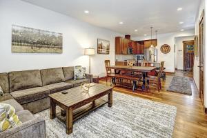 a living room with a couch and a table at Great Location Near Pool with Suncadia Pool Access in Cle Elum
