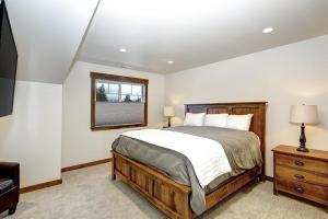 a bedroom with a large bed and a window at Great Location Near Pool with Suncadia Pool Access in Cle Elum +17 photos
