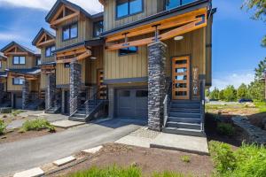 a large house with a garage and a driveway at Suncadia 2 Bdrm Village Chalet Contemporary Cabin in Cle Elum