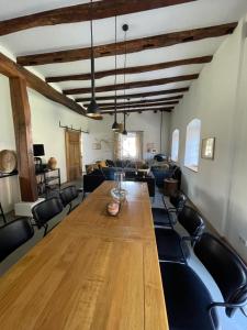 a dining room with a large wooden table and chairs at Ferienhaus Martinshof in Traben-Trarbach