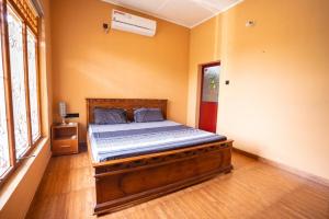 A bed or beds in a room at Sky View Guest house