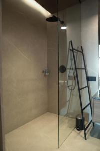 a shower with a glass door in a bathroom at PREMIUM Apartment in center of Katowice in Katowice