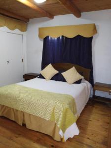 מיטה או מיטות בחדר ב-Cabaña Elu