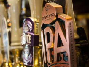 a close up of a bottle of beer on a bar at The Ship in Chelmsford