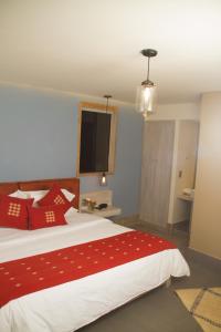 Postel nebo postele na pokoji v ubytování Hotel Helverica
