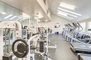 a gym with rows of treadmills and machines at Relaxing Resort Stay Less Than 3 Mi to La Jolla Shores! in San Diego