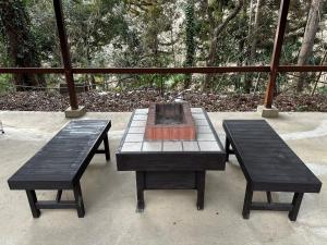 a picnic table with two benches and a fire pit at Nagatoro Camp Village - Vacation STAY 06871v in Minano