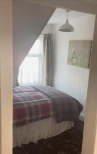 Кровать или кровати в номере Sarnia holiday flats