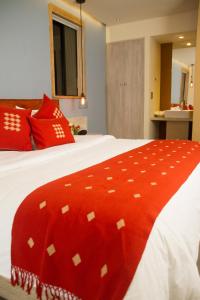 Postel nebo postele na pokoji v ubytování Hotel Helverica