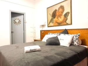 מיטה או מיטות בחדר ב-Amplo Apartamento Em Copacabana