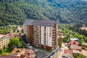 an aerial view of a building in the mountains at Walter Studio Sinaia with Balcony and Private Parking in Sinaia