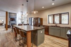 a kitchen with a large island with a counter top at The Juniper - Hot tub in Lead