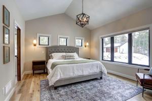 a bedroom with a bed and a large window at The Juniper - Hot tub in Lead +35 photos