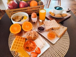 a breakfast tray with breakfast foods on a table at Hotel Conde de Agueda in Águeda