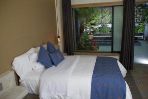 Postel nebo postele na pokoji v ubytování Hotel Helverica