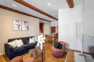 a living room with a couch and a table at Nice Renting - 9b Massena - Chic Escape in the Heart of Nice Comfort & Charm ! in Nice