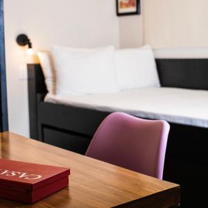 Llit o llits en una habitació de Casa Bruna Luxury Lofts